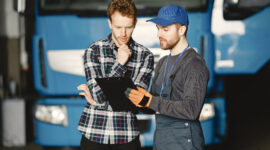 AZ truck driving student reviewing training checklist with instructor during Ontario AZ license preparation.